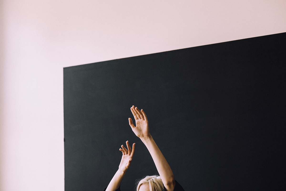 portland person raising both hands arm